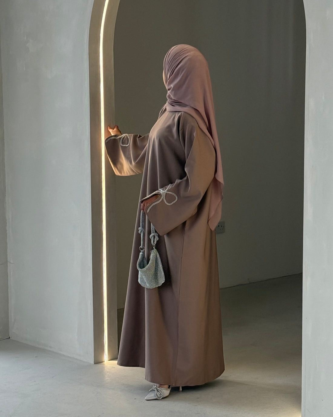Grace In Every Detail – Cherry-Fawn Closed Abaya With Handcrafted Silver Bow Sleeves