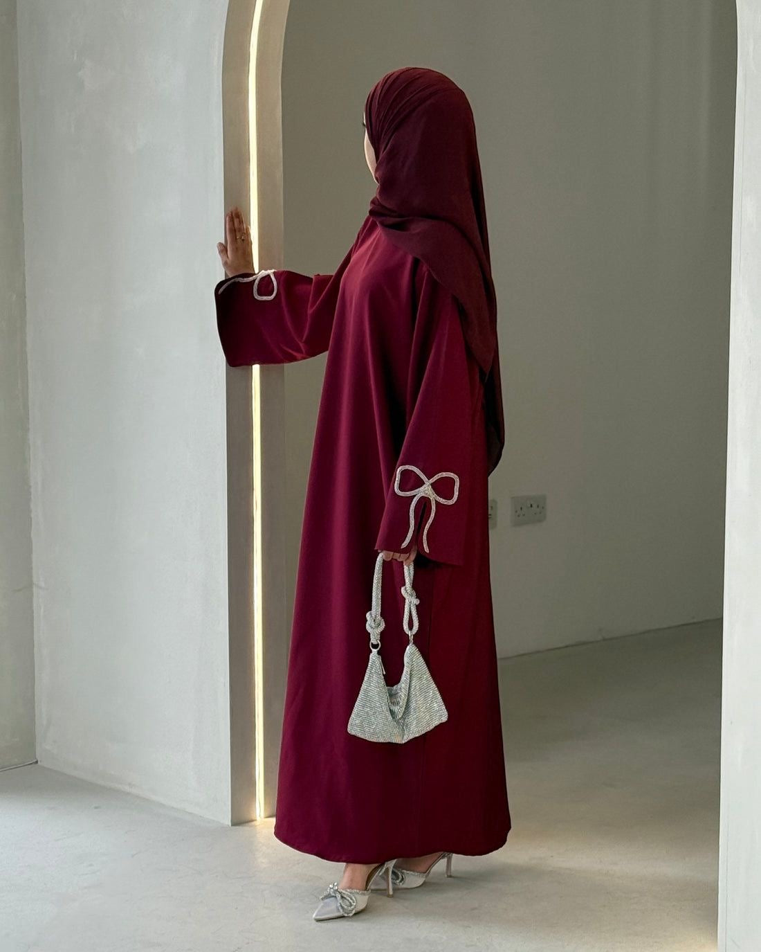 Grace In Every Detail – Cherry-Fawn Closed Abaya With Handcrafted Silver Bow Sleeves