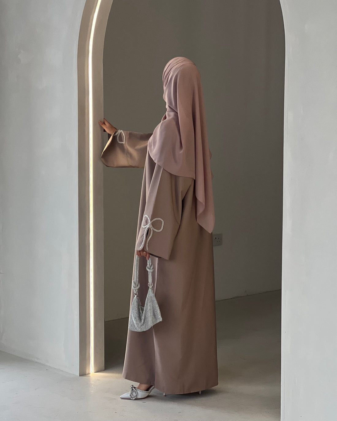 Grace In Every Detail – Cherry-Fawn Closed Abaya With Handcrafted Silver Bow Sleeves