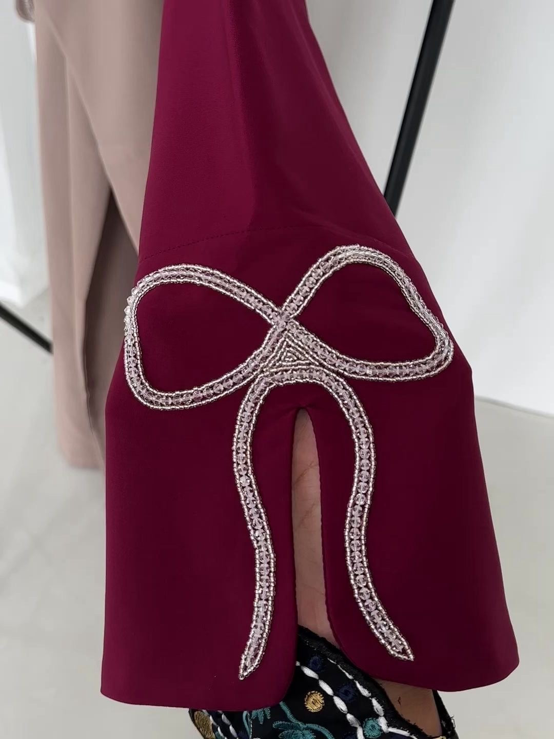 Grace In Every Detail – Cherry-Fawn Closed Abaya With Handcrafted Silver Bow Sleeves