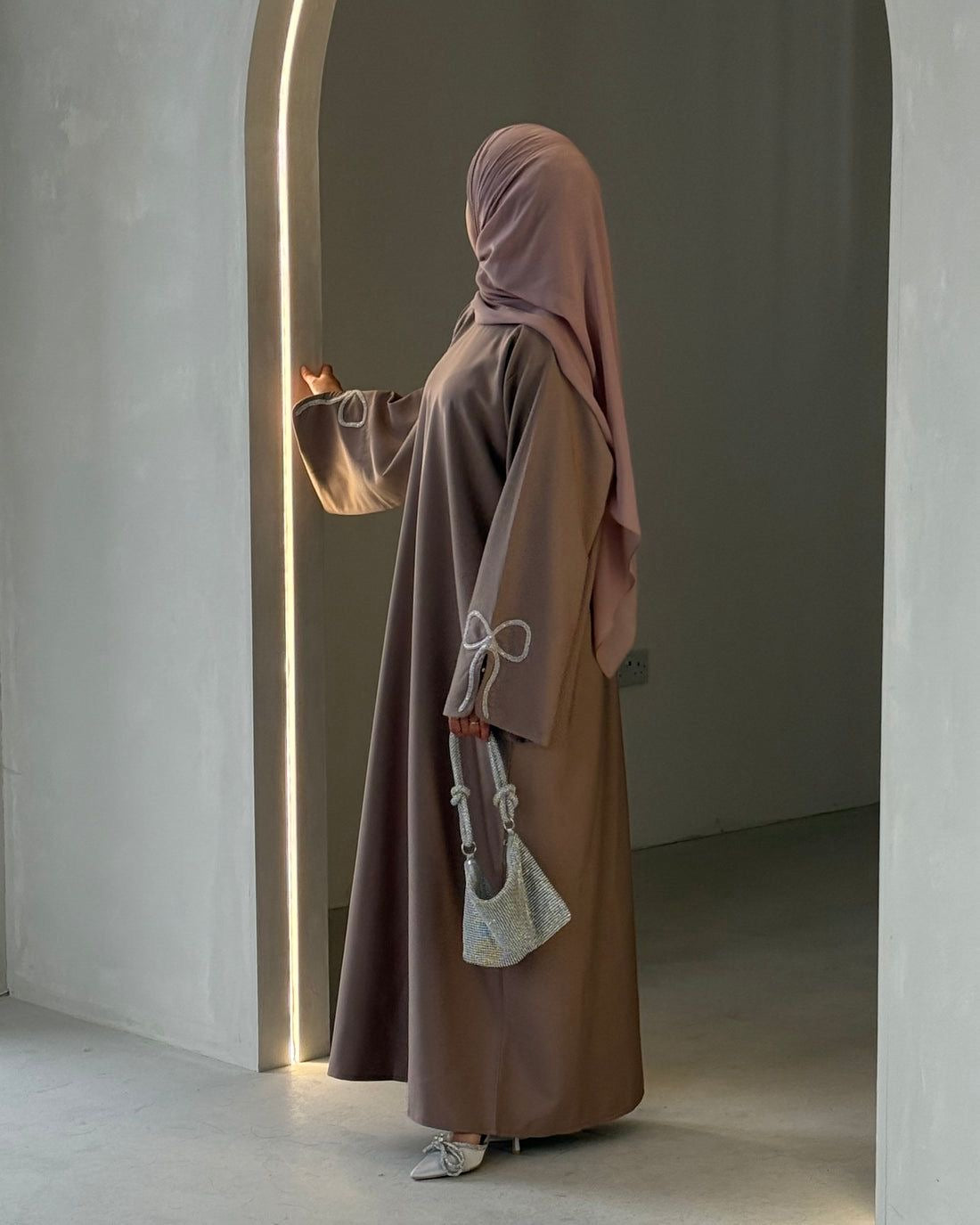 Grace In Every Detail – Cherry-Fawn Closed Abaya With Handcrafted Silver Bow Sleeves