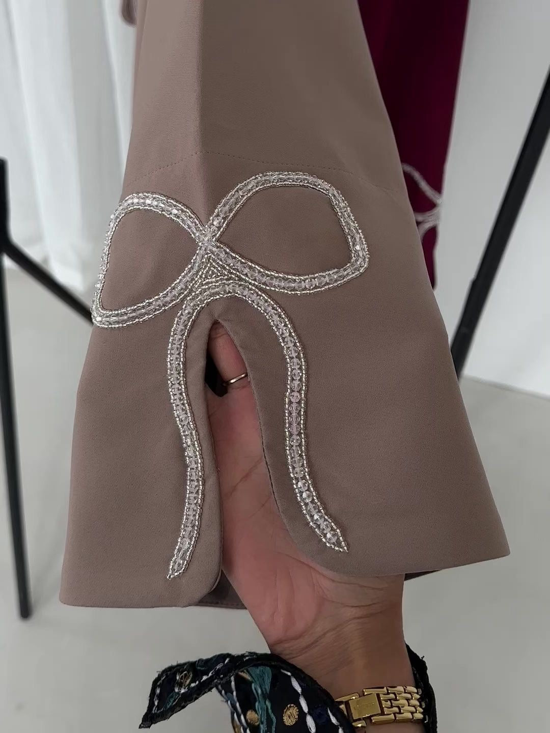 Grace In Every Detail – Cherry-Fawn Closed Abaya With Handcrafted Silver Bow Sleeves